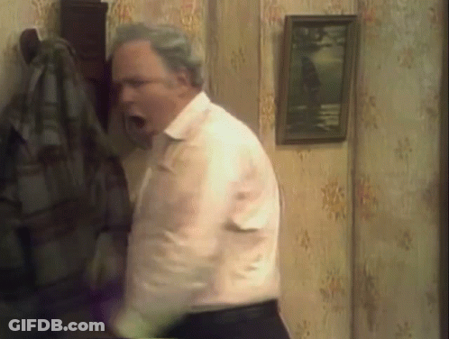 Man In White Shirt And Black Pants Standing With Mouth Open GIF