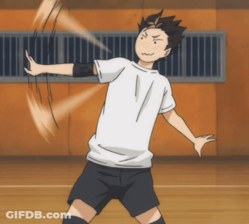 A Man In A White Shirt And Black Shorts Throws A Volleyball GIF