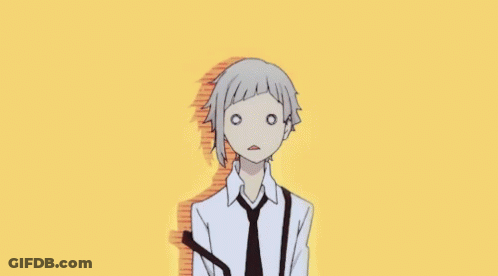 A Man In A White Shirt And Black Tie Is Making A Funny Face . GIF