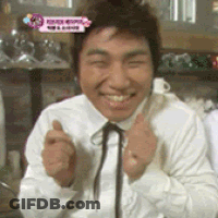 A Man In A White Shirt And Black Tie Is Smiling GIF
