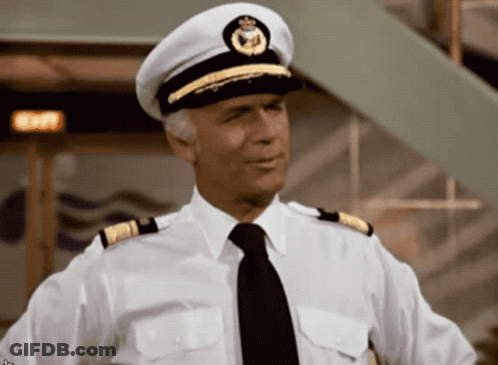 A Man In A White Shirt And Black Tie Is Wearing A White Hat GIF