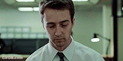 A Man In A White Shirt And Black Tie Looks Down With His Eyes Closed GIF
