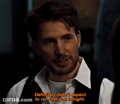 A Man In A White Shirt And Black Vest Says " Definitely Didn 'T Expect To Run Into You Tonight " GIF