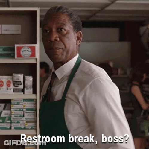 A Man In A White Shirt And Green Apron Says " Restroom Break Boss " GIF