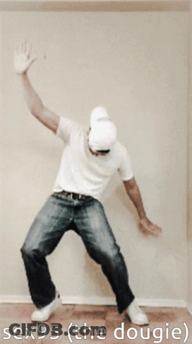 A Man In A White Shirt And Jeans Is Dancing With The Words Sex95 ( The Dougie ) Above Him GIF