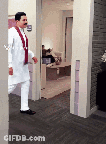 A Man In A White Shirt And Red Scarf Walks Through A Doorway With A Viggle.ai Watermark On The Bottom GIF