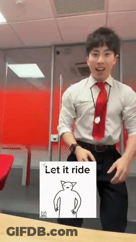 A Man In A White Shirt And Red Tie Is Dancing In Front Of A Sign That Says " Let It Ride " GIF