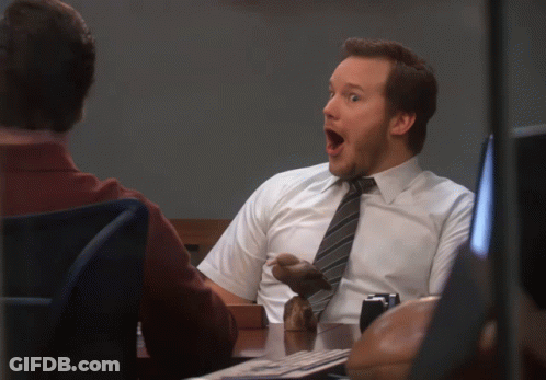A Man In A White Shirt And Tie Has His Mouth Wide Open GIF