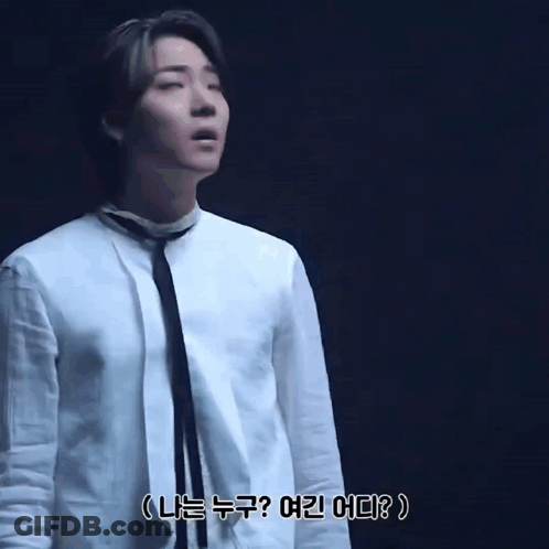 A Man In A White Shirt And Tie Is Asking Who Am I And Where Am I GIF