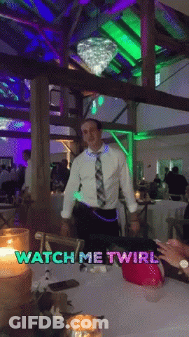 A Man In A White Shirt And Tie Is Dancing In A Room With The Words Watch Me Twirl On The Bottom GIF