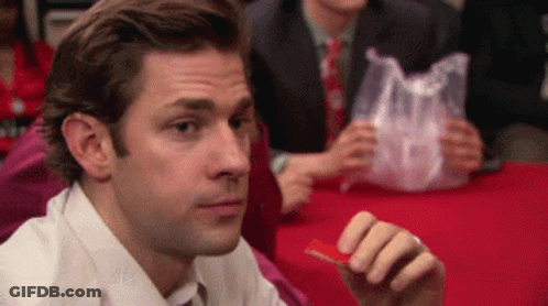 A Man In A White Shirt And Tie Is Eating A Piece Of Food GIF