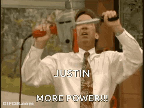 A Man In A White Shirt And Tie Is Holding A Drill And Says Justin More Power !!! GIF