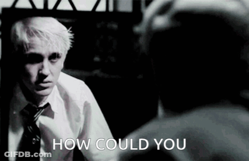 A Man In A White Shirt And Tie Is Looking At Himself In A Mirror And The Words How Could You Are Below Him GIF