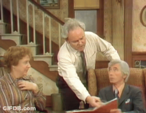 Man In White Shirt And Tie Pointing At Book GIF