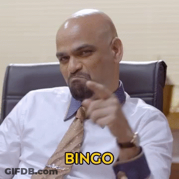 A Man In A White Shirt And Tie Is Pointing At The Camera With The Word Bingo In Yellow GIF
