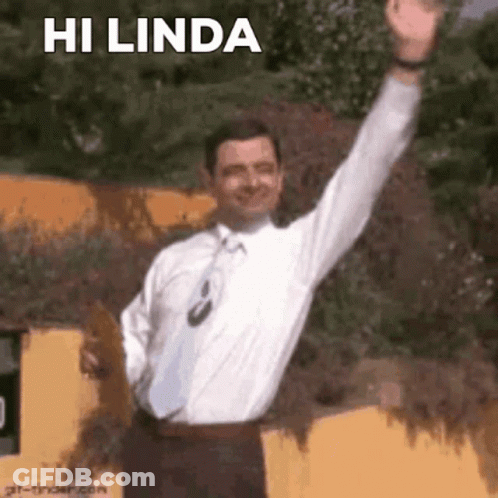 A Man In A White Shirt And Tie Is Raising His Arm In The Air And Saying Hi Linda . GIF