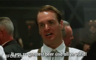 A Man In A White Shirt And Tie Is Saying `` It Was Ze Greatest Beer And All Ze World ! '' GIF