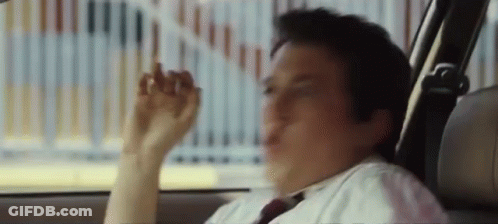 A Man In A White Shirt And Tie Is Sitting In The Back Seat Of A Car . GIF