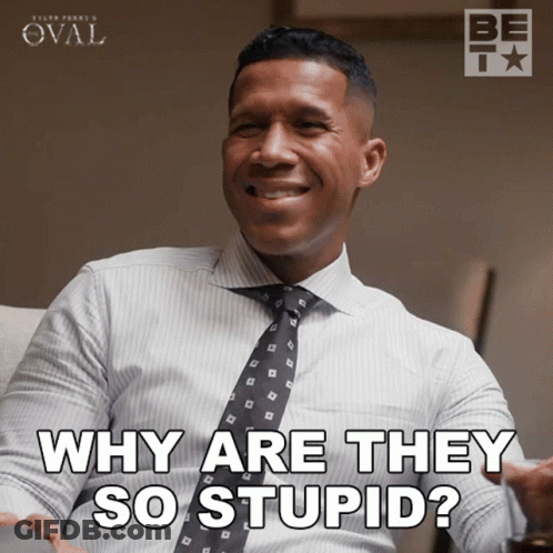 A Man In A White Shirt And Tie Is Smiling And Says Why Are They So Stupid GIF