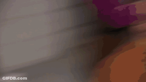A Man In A White Shirt And Tie Is Smiling Behind A Blind GIF