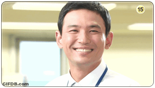 A Man In A White Shirt And Tie Is Smiling With The Number 15 On The Corner GIF