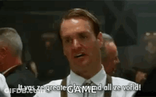 A Man In A White Shirt And Tie Is Standing In Front Of A Group Of Men And Saying `` It Was Ze Greate Game ! '' GIF