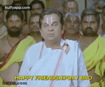 A Man In A White Shirt And Tie Is Standing In Front Of A Group Of Men And Says `` Happy Friendship Day Bro '' . GIF