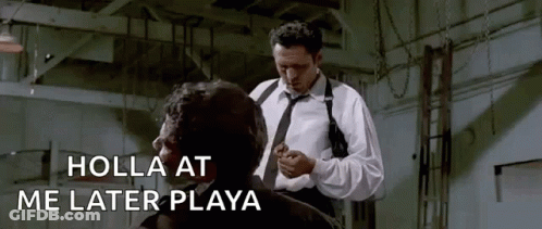 A Man In A White Shirt And Tie Is Standing Next To Another Man In A Room . GIF