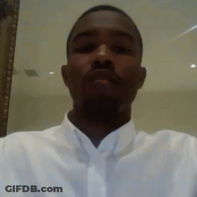 A Man In A White Shirt And Tie Is Taking A Selfie . GIF