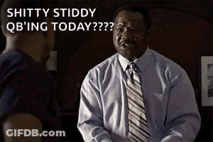 A Man In A White Shirt And Tie Is Talking To Another Man . GIF
