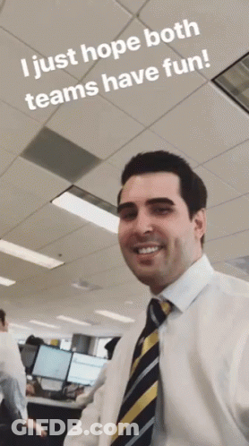 A Man In A White Shirt And Tie Smiles With The Words I Just Hope Both Teams Have Fun Below Him GIF
