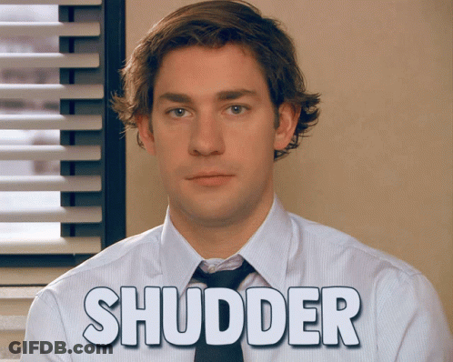 A Man In A White Shirt And Tie With The Word Shudder Written On His Shirt GIF