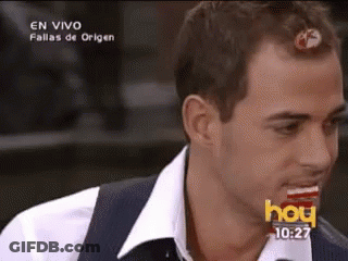 A Man In A White Shirt And Vest Is Eating A Candy Bar On A Television Screen That Says Hoy GIF