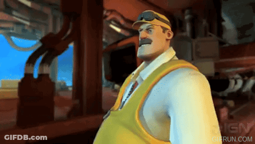 A Man In A White Shirt And Yellow Vest Is Standing In Front Of Ign GIF