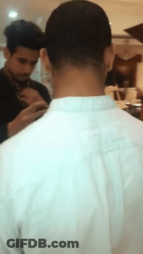 A Man In A White Shirt Has A Tattoo On His Neck That Says ' I Love You ' GIF