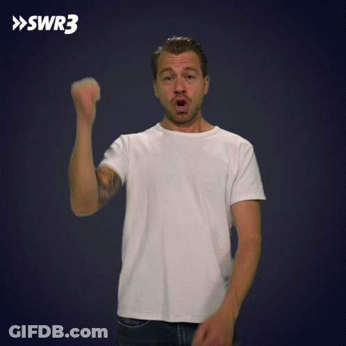 A Man In A White Shirt Holds His Fist Up In Front Of A Blue Background With Swr3 Written On It GIF