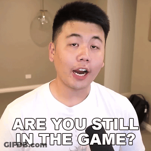 A Man In A White Shirt Is Asking " Are You Still In The Game " GIF
