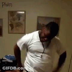 A Man In A White Shirt Is Dancing In A Room With The Name Philm Written On The Wall GIF