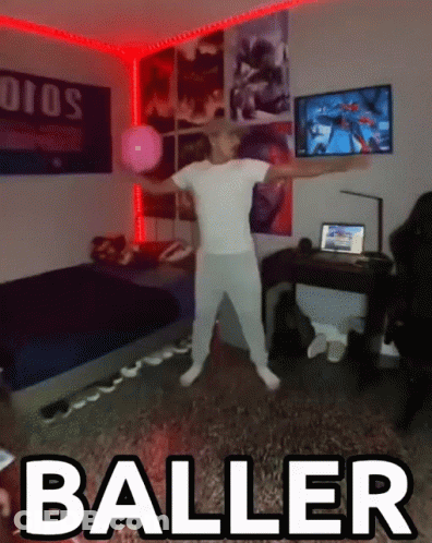 A Man In A White Shirt Is Dancing In A Room With The Word Baller Above Him GIF