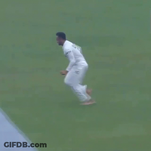 A Man In A White Shirt Is Doing Push Ups In The Ocean . GIF