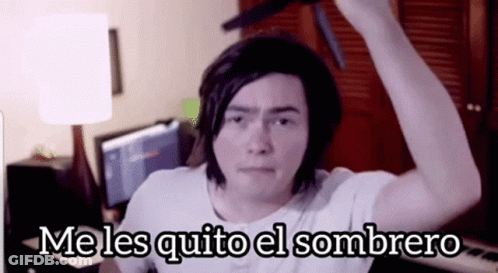 A Man In A White Shirt Is Holding A Knife Over His Head With The Words Me Les Quito El Sombrero Above Him GIF