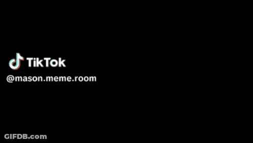 A Man In A White Shirt Is Holding A Light And A Tiktok Logo Is Visible GIF