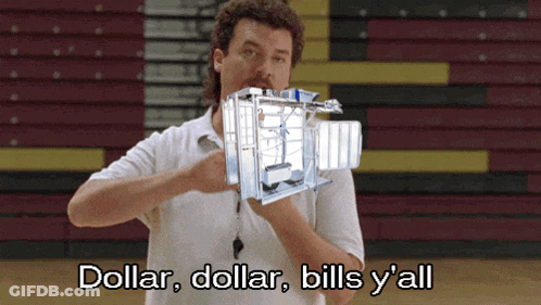 A Man In A White Shirt Is Holding A Machine That Says Dollar Dollar Bills Y All GIF