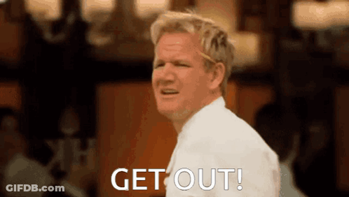 A Man In A White Shirt Is Making A Funny Face And Saying Get Out . GIF