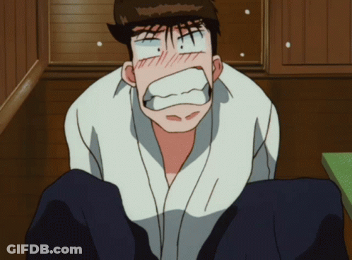 A Man In A White Shirt Is Making A Surprised Face GIF