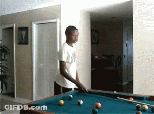 A Man In A White Shirt Is Playing Pool In A Room GIF