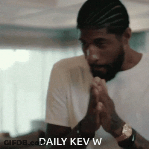 A Man In A White Shirt Is Praying With The Words Daily Kev W Written Below Him GIF