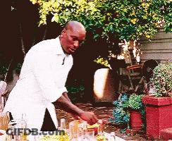A Man In A White Shirt Is Preparing A Meal Outside GIF