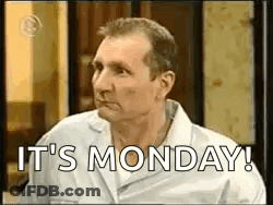 A Man In A White Shirt Is Saying `` It 'S Monday '' While Sitting In A Room . GIF