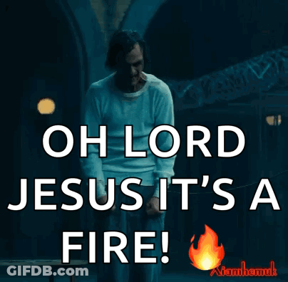 A Man In A White Shirt Is Saying Oh Lord Jesus It 'S A Fire .. GIF